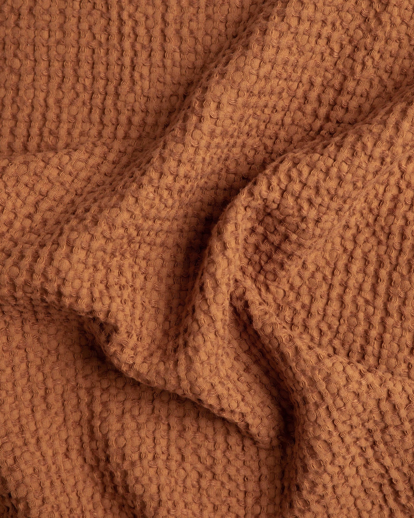 Waffle linen couch cover in Cinnamon
